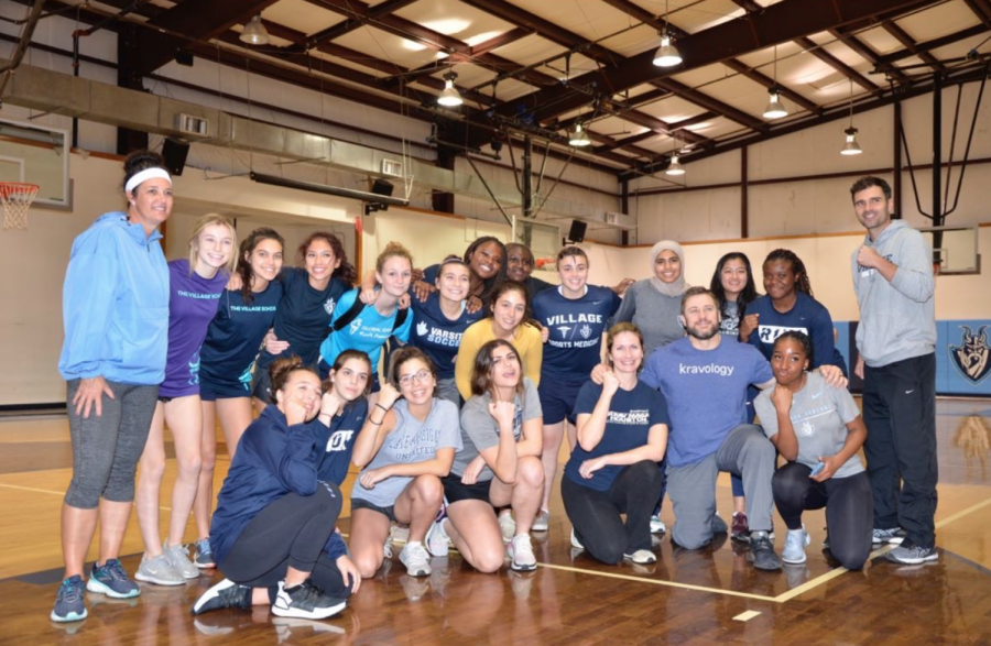 Krav Maga participants pose for a photo in the Moore Gym. 
