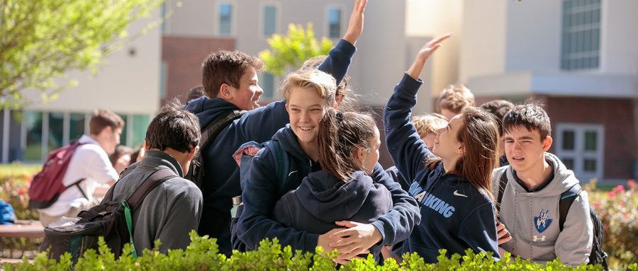 The Village School students socializing near the patio. 
