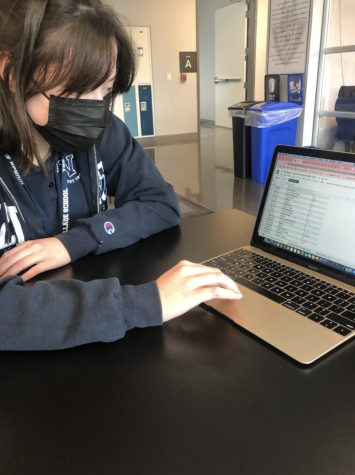 Megan Gunter (12) looking at the list of courses available.