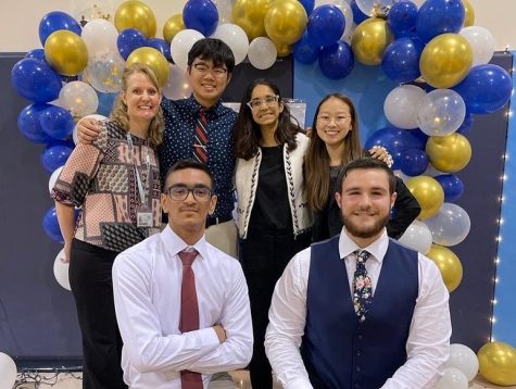 [From left to right] Pictured are Diana Spiers, Tommy Wan (12), Aditi Iyer (11), Caroline Hsu (11), Arham Hassan (12), and Marshall De Benedicitis (12), the NHS leadership team, gathered for a photo after the ceremony. 