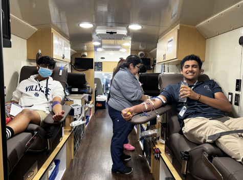 Krish Shah (11) and Anjai Gupta (11) as they donate blood in the Gulf Coast Regional Blood Center Truck. 