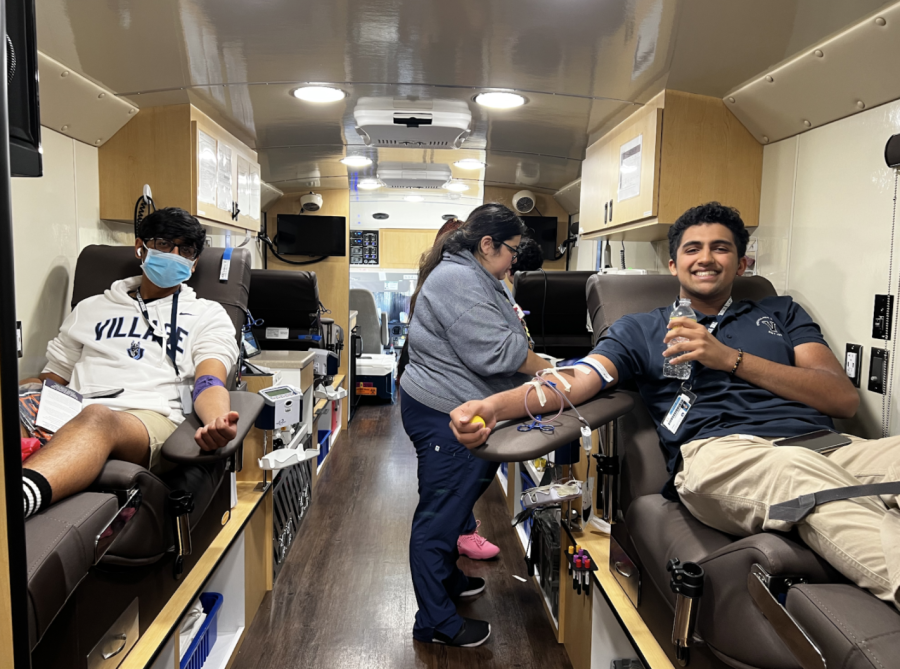 Krish+Shah+%2811%29+and+Anjai+Gupta+%2811%29+as+they+donate+blood+in+the+Gulf+Coast+Regional+Blood+Center+Truck.+