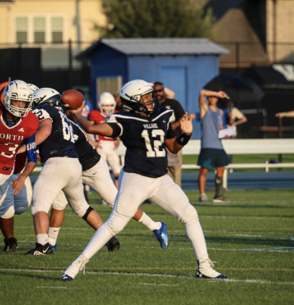 Quarterback Devon Stephenson (11) throws the ball to his teammates. 