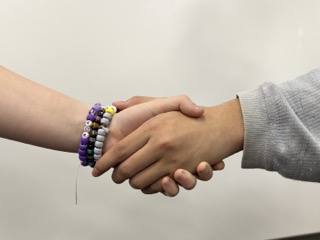 Two students holding hands, picture taken by senior Marlen Gomez.

