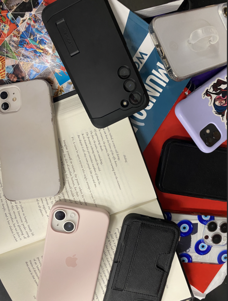 Students phones displayed over school work