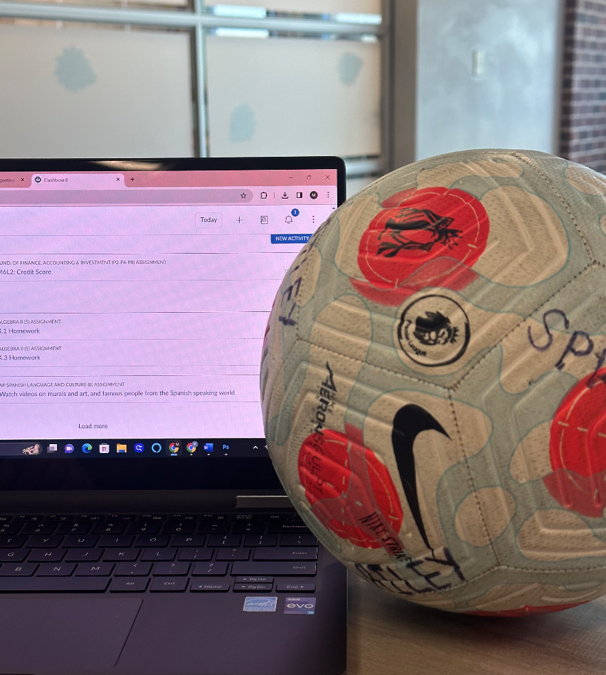A soccer ball next to a students Canvas