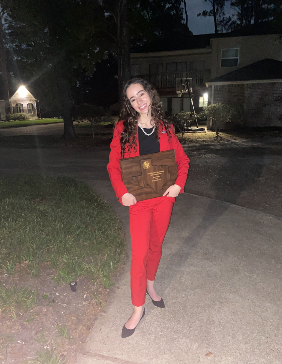 Solemei Scamaroni posing with her Runner Up plaque from the Texas State Championship Tournament; earned because of this Original Oratory. 