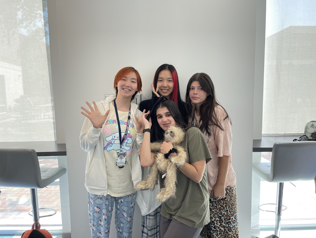 Annali Zhao, Sophie Newman, and Eshani Gale dressed in pajamas