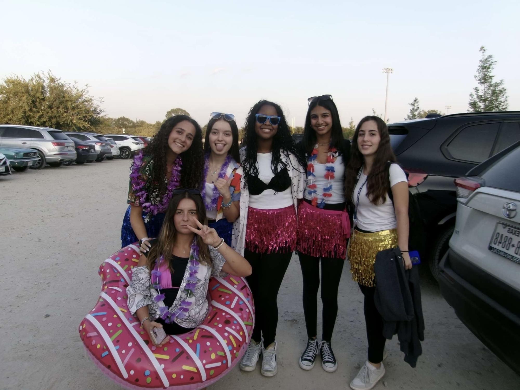 Juniors Maram Boulos, Maria Antunes, Maria Filipe, Nina Koshy, Valentina Navarro and senior, Agnes Pereira dressed up as surfers  