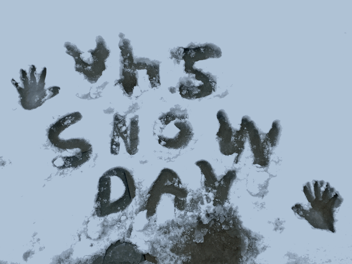 Writing in the snow coating the ground of a backyard.