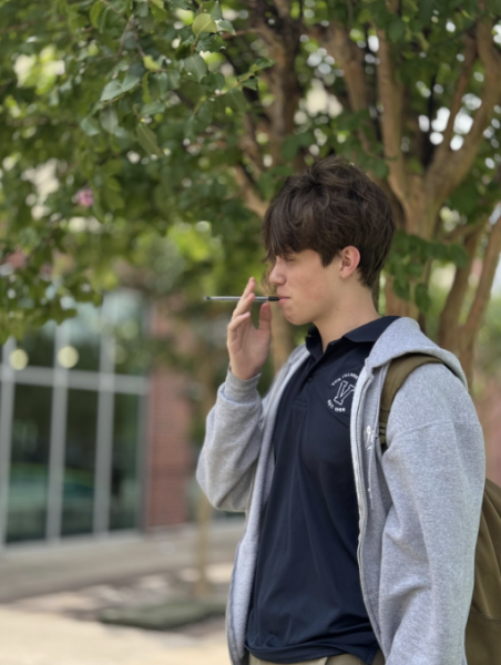 Dylan Stanley (10) is illustrating a person smoking. 