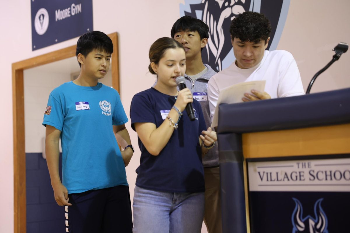 Student Government President Eddie Wang (12), Vice President Anthony Rodas (12), Student Operations Manager Andy Wu (12) and Class of 2026 Representative Maria Antunes (12) take attendance at the beginning of the 1st Annual Student Leadership Conference on Aug. 30, 2025. 

