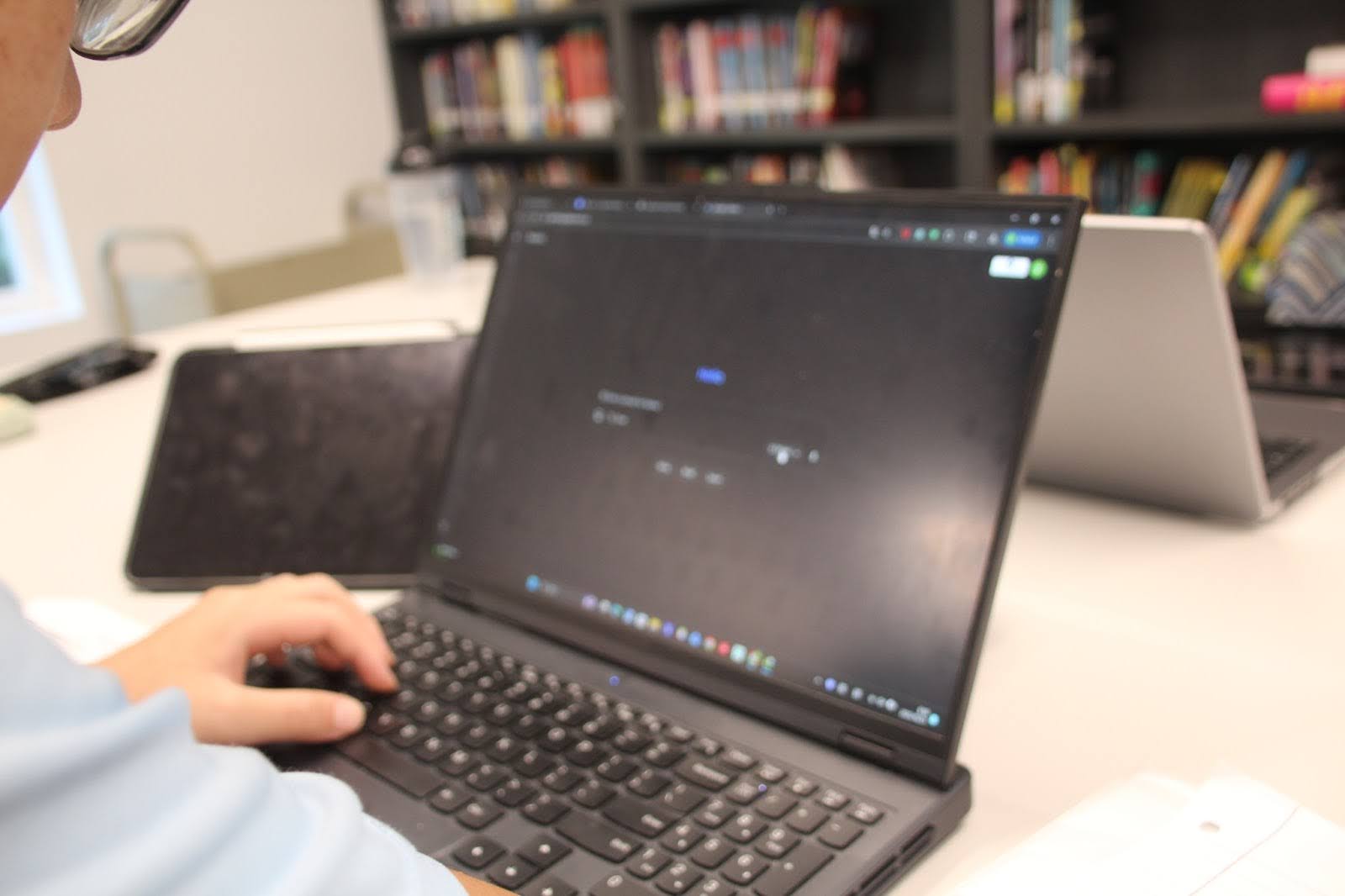 A student explores Gemini, Google’s AI, during a study session in the school library.
