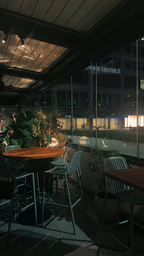 The city view, warm lights and glass walls- a look into the perfect evening at Joey Uptown.