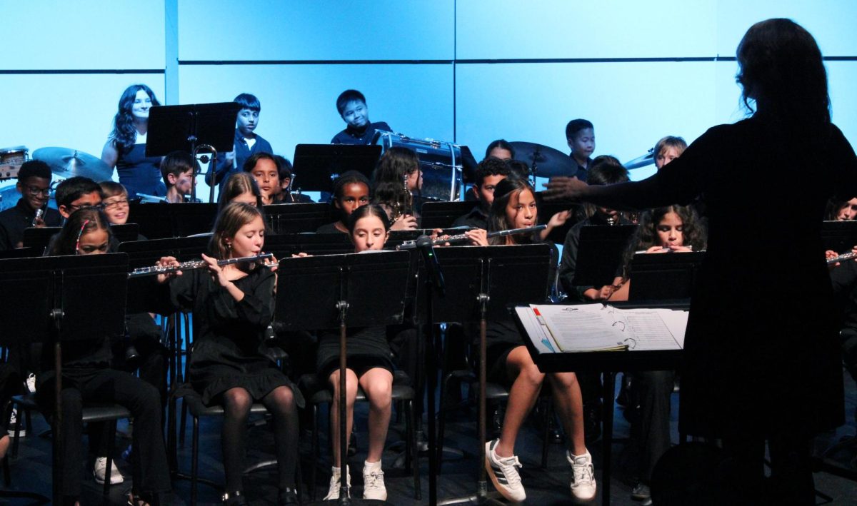 Conducting Synergy, Band Director Sarah Perkins led charge for the middle school band. 
